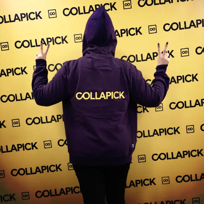 Henkilö selin Collapick-huppari päällä